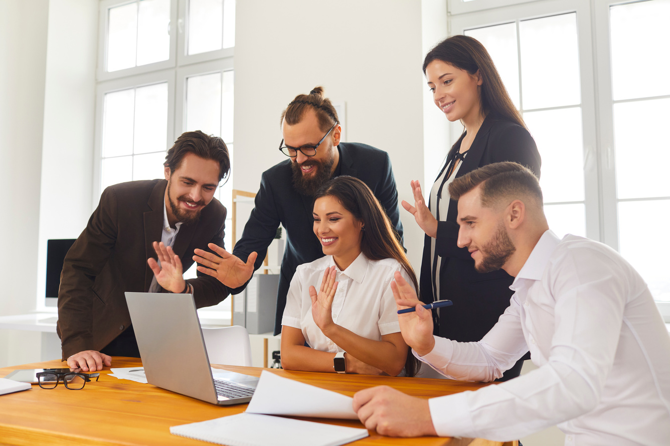 Happy Company Workers Waving Hands at Laptop Screen Greeting Boss during Video Call